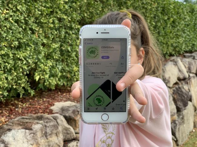 A school pupil shows the COVIDSafe app.