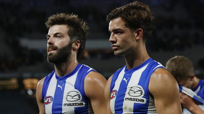 North Melbourne co-captains Jy Simpkin (right) and Luke McDonald are searching for form, with very few senior players to support them in the winless Kangaroos side. Picture: Michael Klein