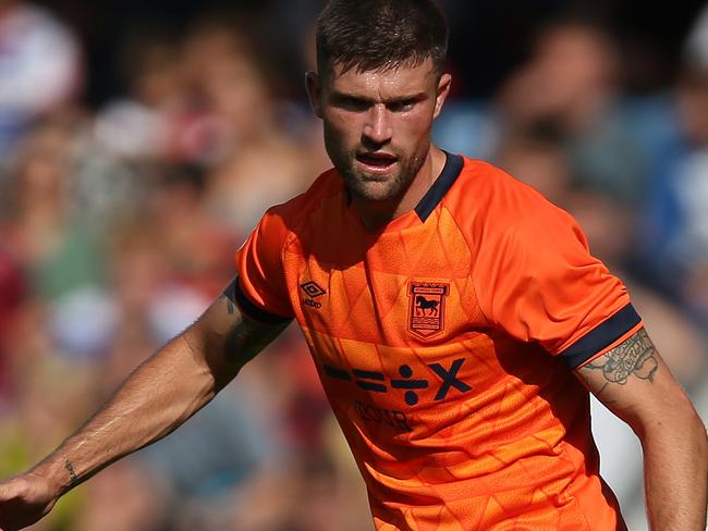 LONDON, ENGLAND - AUGUST 19: Cameron Burgess of Ipswich Town passes the ball during the Sky Bet Championship match between Queens Park Rangers and Ipswich Town at Loftus Road on August 19, 2023 in London, England. (Photo by Steve Bardens/Getty Images)