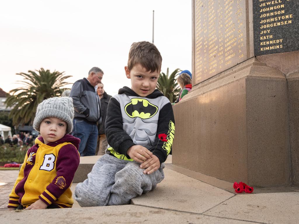 Laying poppies after Toowoomba's Anzac Day dawn service are Dominic (left) and Owen Edwards at the Mothers' Memorial, Thursday, April 25, 2024. Picture: Kevin Farmer