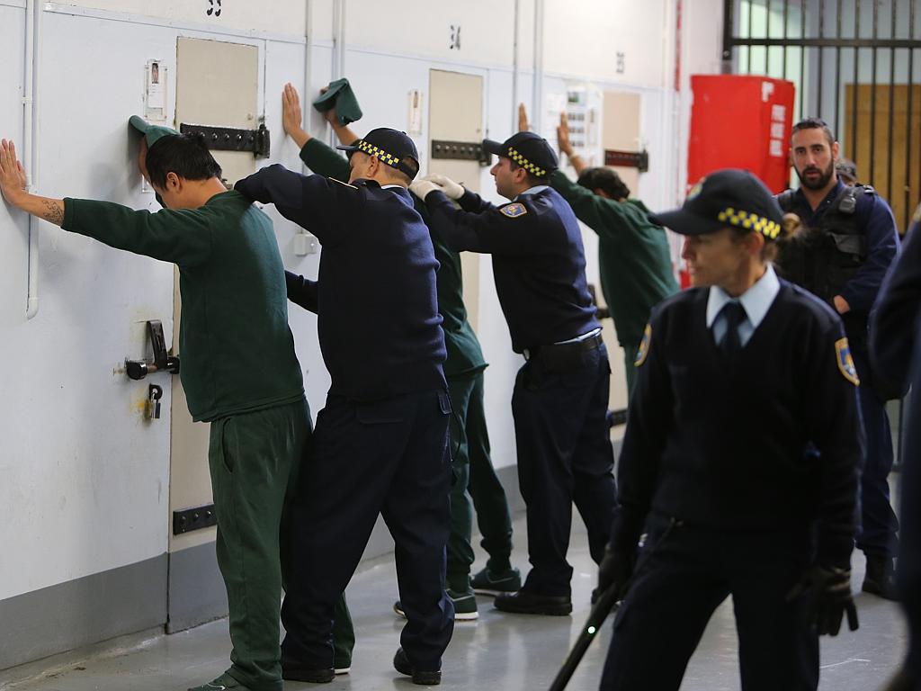 Inmates being searched by correctional officer trainees at Long Bay. Picture: Tim Hunter