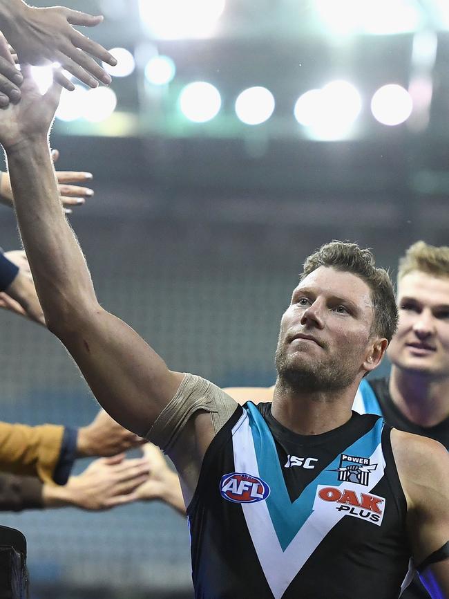 Brad Ebert high fives fans after winning the round six match against North Melbourne. Picture: Quinn Rooney/Getty Images