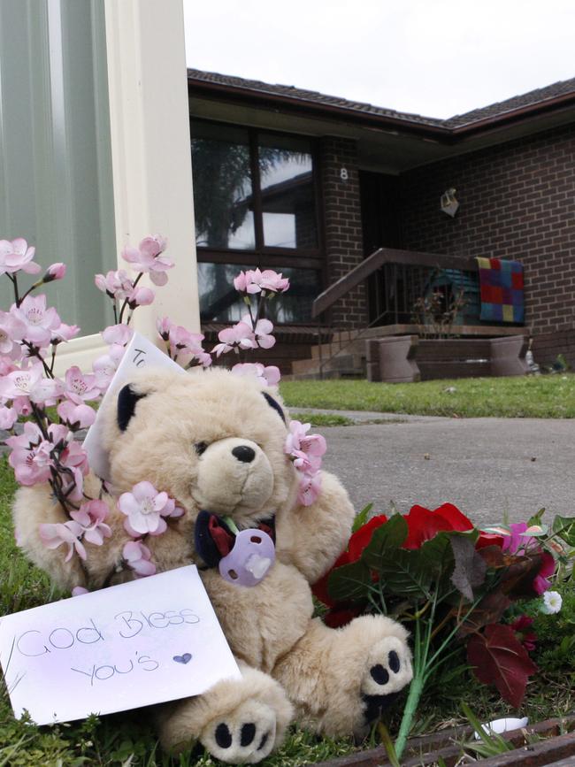 A teddy and flowers left at the Deaves house after the death of two-year-old Tanilla.