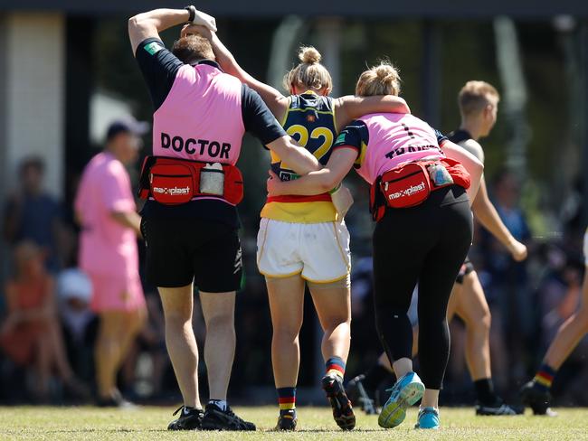 Cramey in the hands of club medicos after being injured in a game against Collingwood in 2017. Picture: MICHAEL WILLSON/AFL MEDIA/GETTY IMAGES