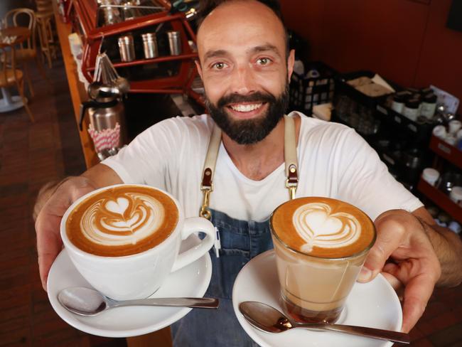 Drinking two or three cups of coffee a day is not just good for you, it may even be the elixir to a longer life. An analysis of more than 382,000 people by Melbourne cardiologists has found significantly lower risks of heart disease and early death among those with a daily coffee habit. Barista Evan Hatzis sharing the love at Bentwood Cafe Fitzroy.                      Picture: David Caird