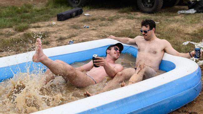 Two mates enjoy a mud pool. Picture: James Gourley/Getty Images