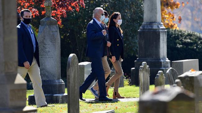 Joe Biden visits the graves of his son Beau and first wife Neilia and daughter Amy. Picture: AFP