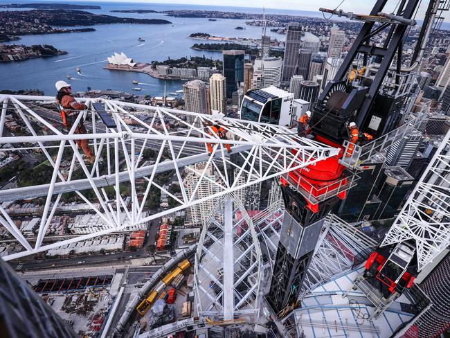 A highly-skilled team of riggers from Sydney crane company Marr Contracting working 300m above Sydney to remove the crane that has been perched above Crown Sydney.