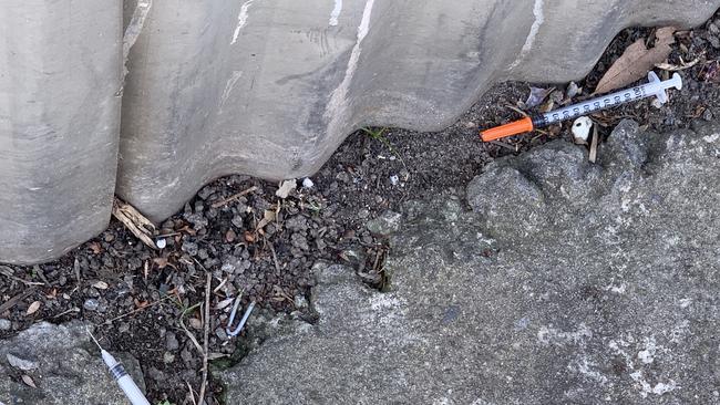 Used syringes and mounds of rubbish were found in a laneway on Hemmings St. Picture: Suzan Delibasic