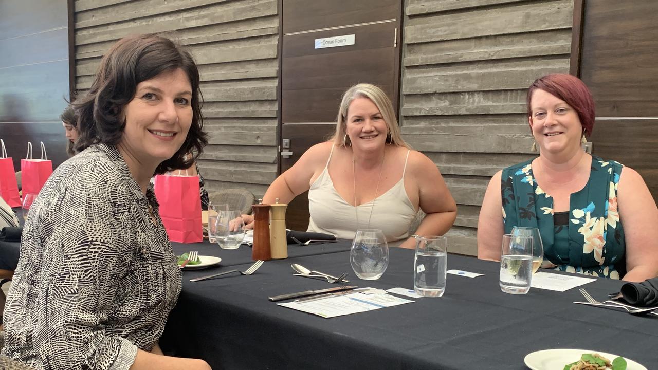 Marita Kruger, Melinda Cauduro, and Jaya McIntyre chat over drinks.