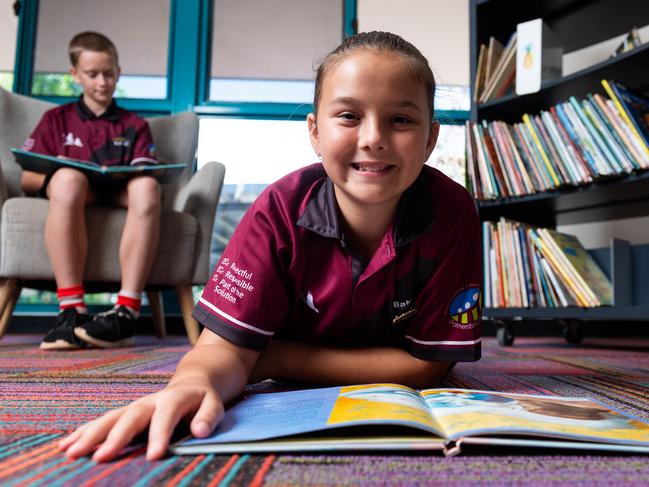 Bakewell Primary is scatterng recess times, making sure all kids have their own water bottles, and no one is allowed on playgrounds before or after school. Most schools around the Territory are doing the same thing. Ailie McCann and Samuel McKay practice social distancing in their school library.Picture: Che Chorley