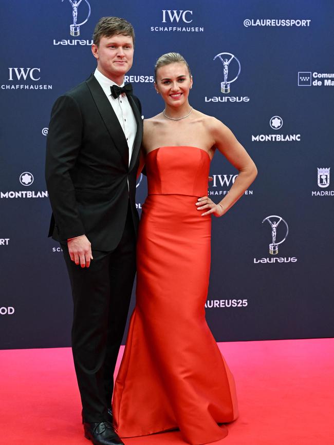 Titmus with her partner Mack. Picture: JAVIER SORIANO / AFP