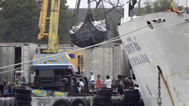 Frozen seafood is off-loaded from a refrigerated cargo ship called the Silver Sea Line, a 3,000-ton cargo ship, at Thajeen Port in Samut Sakhon, Thailand, 15 days after it set sail from Benjina, Indonesia.