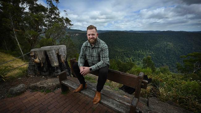 Leighton Pitcher on the old lodge’s original bricked terrace, the only surviving remnant, where in 2019 he watched the advancing fire that destroyed the historic building. Picture: Lyndon Mechielsen