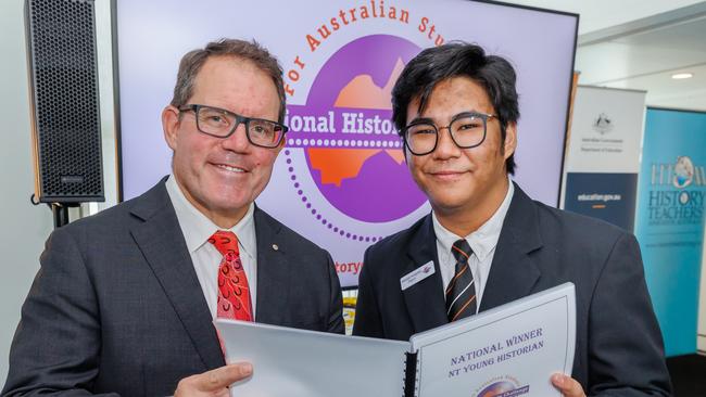 Darwin High School student Monishi Rangchak Tripura – pictured with Solomon MP Luke Gosling – has been named the NT’s Young Historian of the year for his research on the Chittagong Hill Tracts Peace Accord in 1997. Picture: Steve Keough