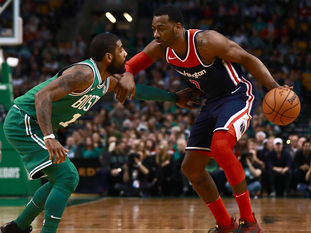 John Wall faces off with fellow NBA star Kyrie Irving. Picture: Getty Images/AFP