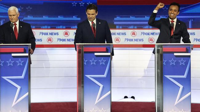 Republican presidential candidates (L-R), former U.S. Vice President Mike Pence, Florida Gov. Ron DeSantis and Vivek Ramaswamy take the stage for the first debate of the GOP primary season. Picture: Getty Images via AFP.