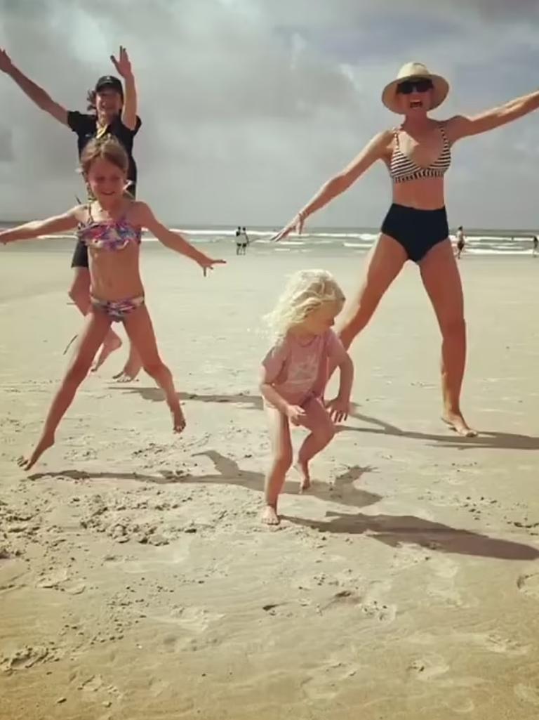 Carrie (right) enjoys beach time with the fam.