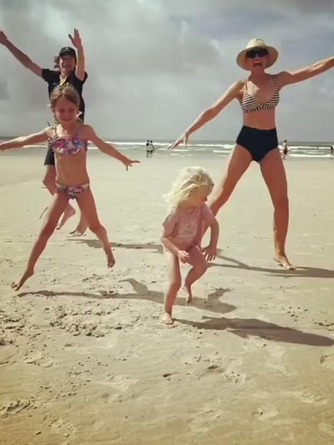 Carrie (right) enjoys beach time with the fam.