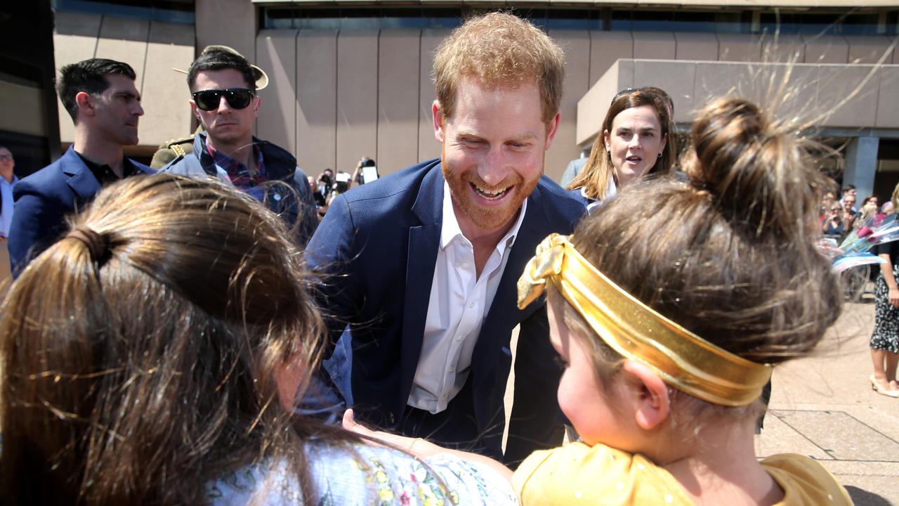 The Duke and Duchess of Sussex Prince Harry and his wife Meghan Markle meet the people during their walk along the Sydney Opera House forecourt.