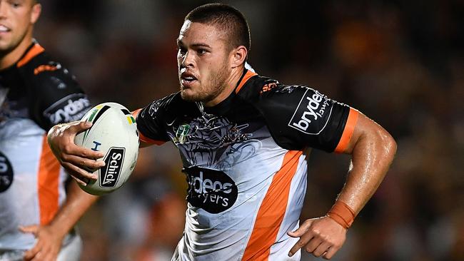 Tui Lolohea makes a break for the Wests Tigers.