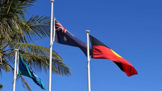 HIGH AND PROUD: The Torres Strait Island, Australian and Australian Aboriginal flags. Picture: Christine McKee