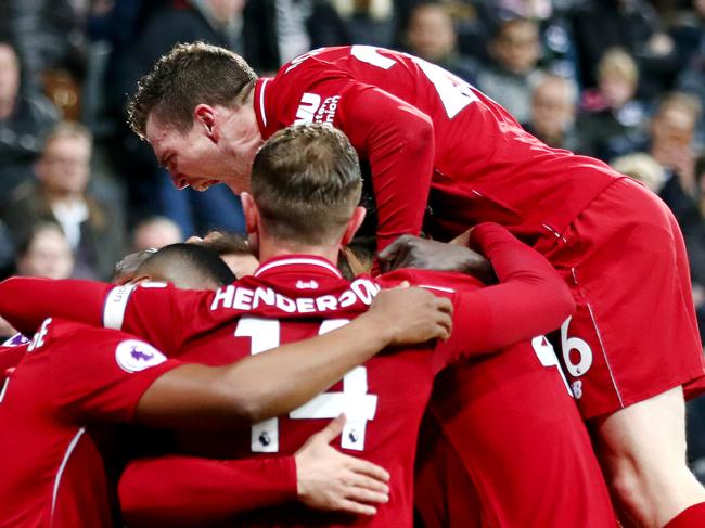 NEWCASTLE UPON TYNE, ENGLAND - MAY 04: Divock Origi of Liverpool celebrates with teammates after scoring his team's third goal during the Premier League match between Newcastle United and Liverpool FC at St. James Park on May 04, 2019 in Newcastle upon Tyne, United Kingdom. (Photo by Clive Brunskill/Getty Images)