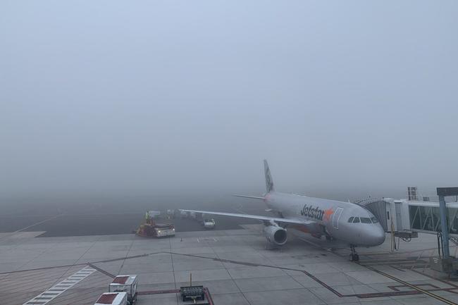 Fog over the Adelaide Airport tarmac. Picture: Tim Yeatman