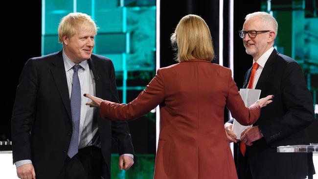 British Prime Minister Boris Johnson (left) and Labour Party leader Jeremy Corbyn (right) join host Julie Etchingham for "Johnson v Corbyn: The ITV Debate" in Salford. Picture: AFP