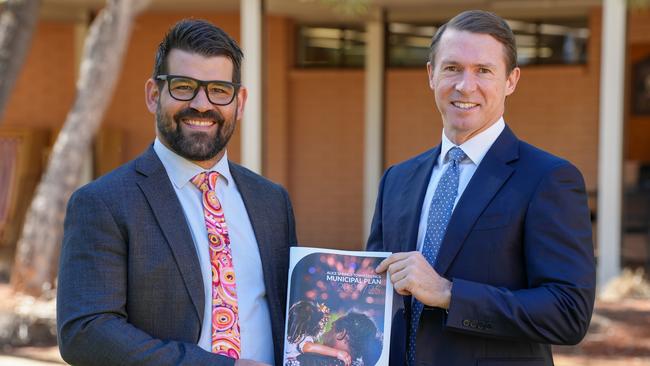 Alice Springs Town Council Mayor Matt Paterson and chief executive Andrew Wilsmore with the 2024-25 draft municipal budget, which is open for comment until June 12.