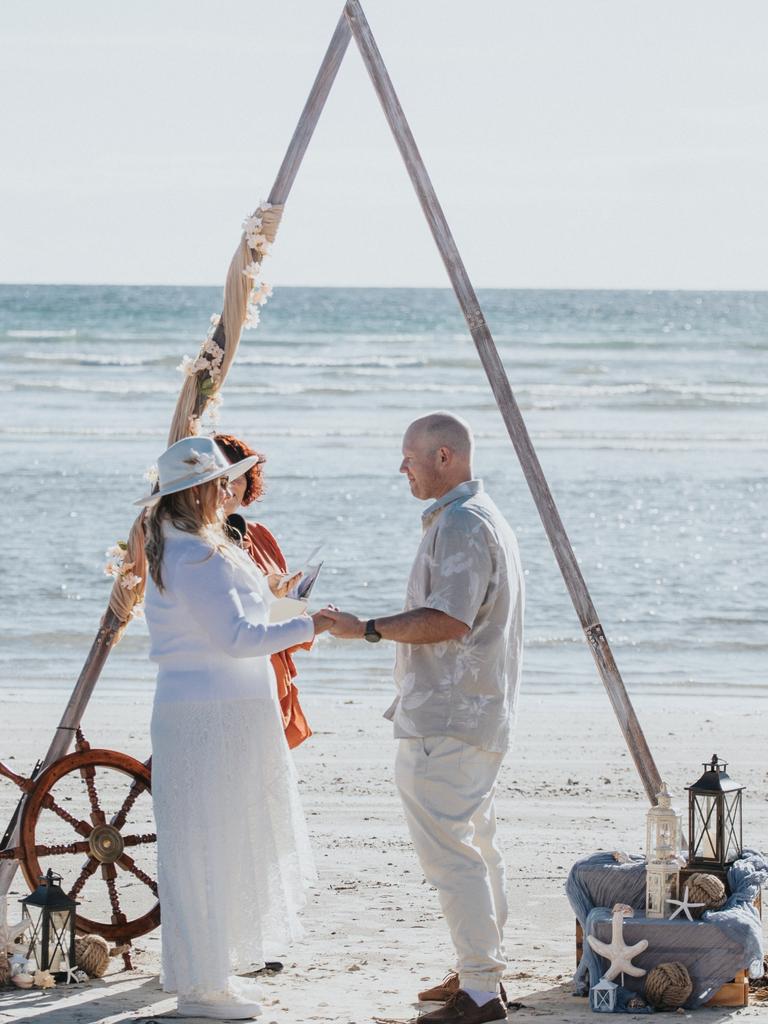 Jessica Schuller and Mathew Siddall say their vows at North Beach, Wallaroo. Picture: Dan Glasgow