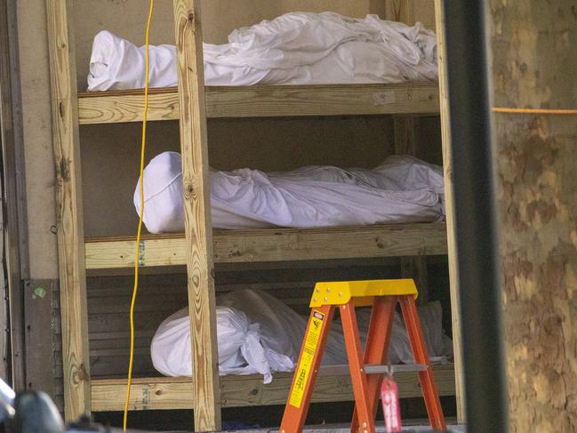 Bodies are stacked on shelves in a refrigerated container at Kingsbrook Jewish Medical Center in New York. Picture: AP