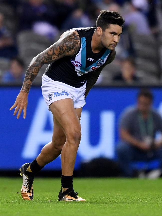 Port Adelaide midfielder-forward Chad Wingard feeling his hamstring — again — late in the Power’s win against North Melbourne at Etihad Stadium on Saturday. Picture: Joe Castro