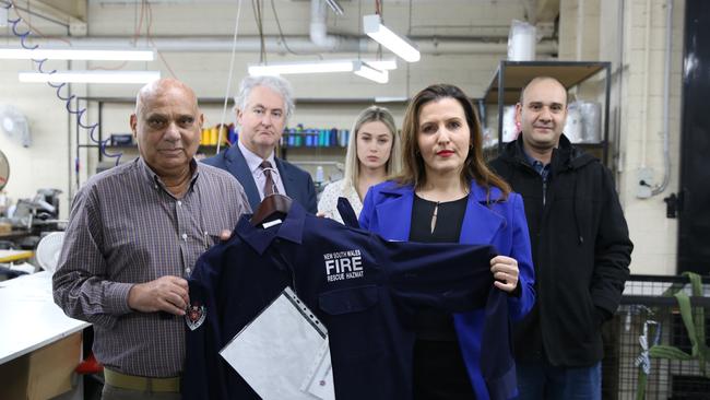 Owner Hassan Abdelrahim, NSW Labor Leader in the Legislative Council Adam Searle, Casey Thompson, Compliance Officer, Manufacturing Division, Construction Forestry Maritime Mining &amp; Energy Union (CFMMEU), Bankstown Labor MP Tania Mihailuk holding NSW Fire and Rescue uniforms Sphinx used to make for the NSW Government and Owner Tom Abdelrahim. Picture: SUPPLIED