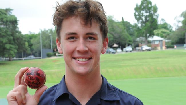 SEVENTH HEAVEN: Toowoomba Grammar's Henry Wells proudly displays his game ball from his seven-wicket haul against The Southport School. Photo: Sean Teuma