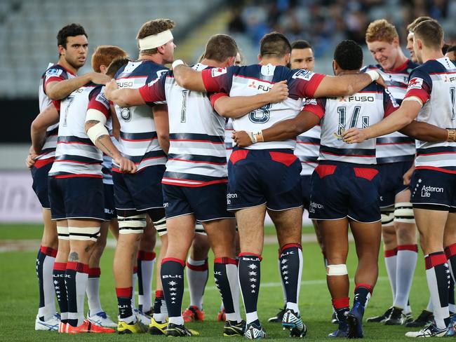 **FILE** A Saturday, April 30, 2016 image reissued Monday, April 10, 2017 of Rebels players at the start of the Round 10 Super Rugby match between the Blues and Melbourne Rebels at Eden Park in Auckland. The Western Force and Melbourne Rebels will learn within three days which of them is to be axed, Australian Rugby Union chairman Cameron Clyne says. It's part of a broader restructure of an unwieldy and unpopular Super Rugby competition format, which is to be slashed from 18 teams to 15 after this season, with two South African sides also to go. (AAP Image/David Rowland) NO ARCHIVING, EDITORIAL USE ONLY