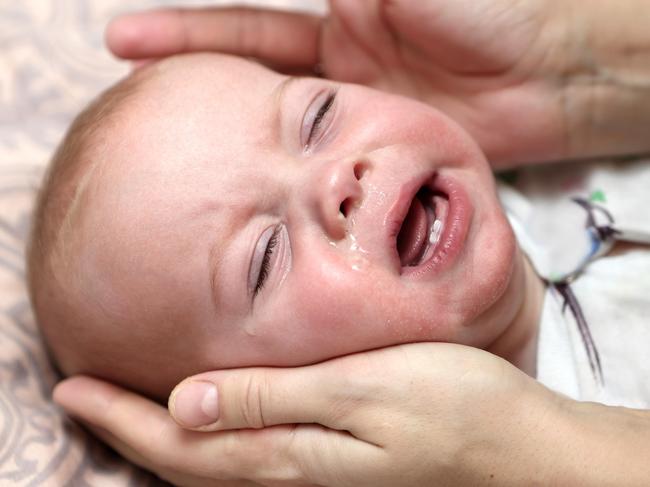 Crying child with a runny nose at home Picture:Istock