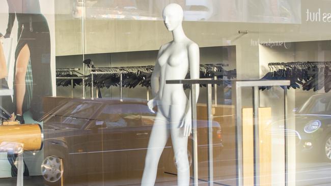 Empty clothes racks inside a Chapel St women’s fashion store. Picture: Wayne Taylor