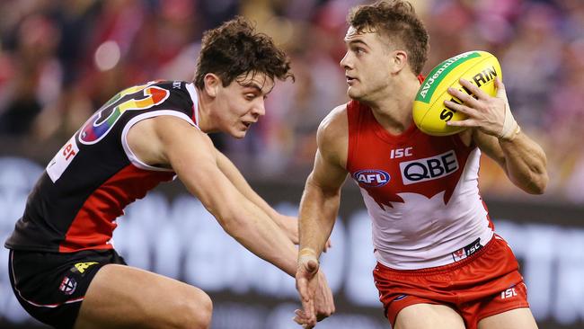 Sydney’s Tom Papley sidesteps past Nick Coffield. Picture: Michael Klein