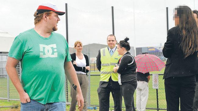 An angry fan hurls abuse at "The St Kilda Girl", who attended St Kilda training yesterday.