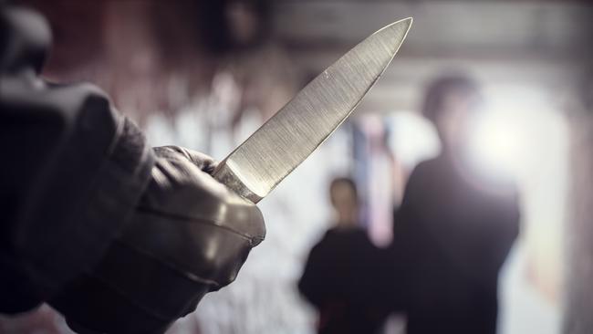 Generic crime Istock  -  Criminal with knife weapon threatening woman and child in underpass crime