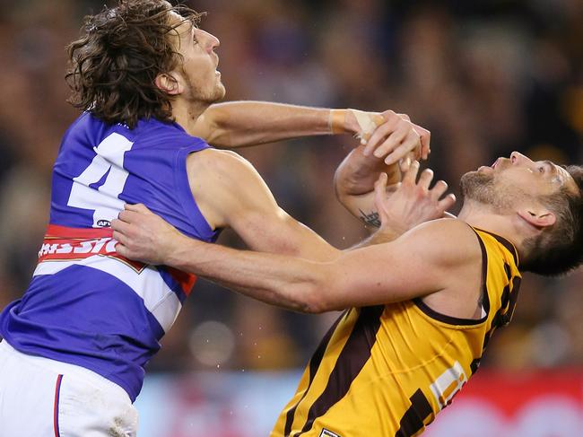 AFL. 2nd Semi Final. Hawthorn v Western Bulldogs at the MCG. Marcus Bontempelli shoves Luke Hodge out of the way in the marking contest  . Pic: Michael Klein.