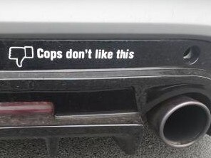 A hoon's bumper sticker. Police later slapped him with yellow “canary” for having an unroadworthy car.