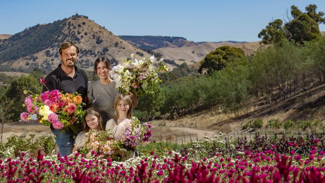 Natasha and Hayden Benefield, pictured here with their kids Eden and Leni, shared their story about running the boutique regenerative flower farm Bloom into You, at Flowerdale. Picture: Zoe Phillips