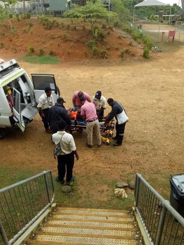 A refugee patient being loaded into an ambulance for transfer. Picture: Marian Faa