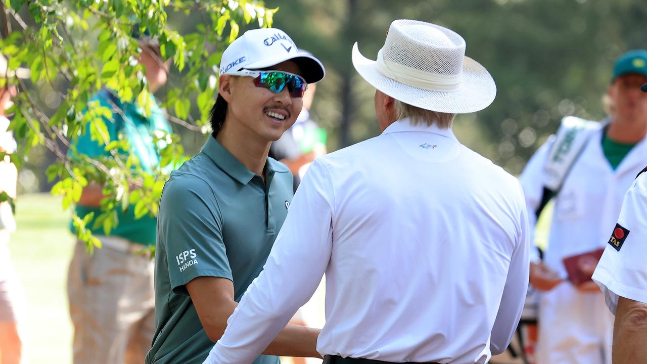Min Woo Lee meets Greg Norman at the Masters. Picture: David Cannon/Getty Images