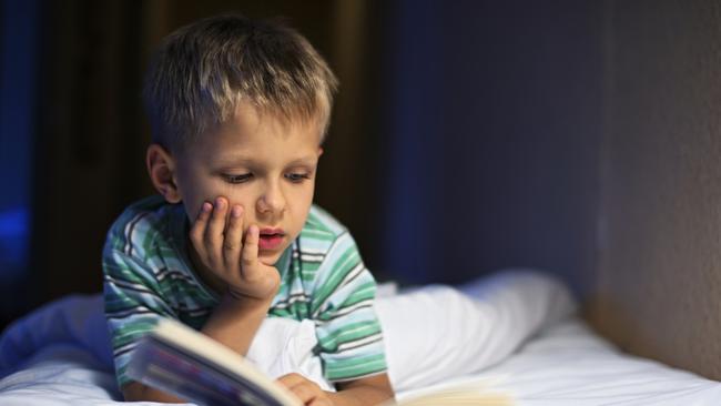 A six-year-old boy discovered being “in the zone” with a book before bed.