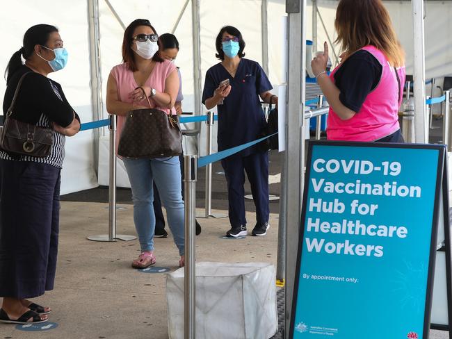 Health care workers arrive to get their vaccination in Sydney. Photo: NCA NewsWire / Gaye Gerard