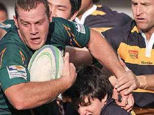 University hooker Michael Todd makes a break before going on to score beside the posts. Picture: Brett Wortman