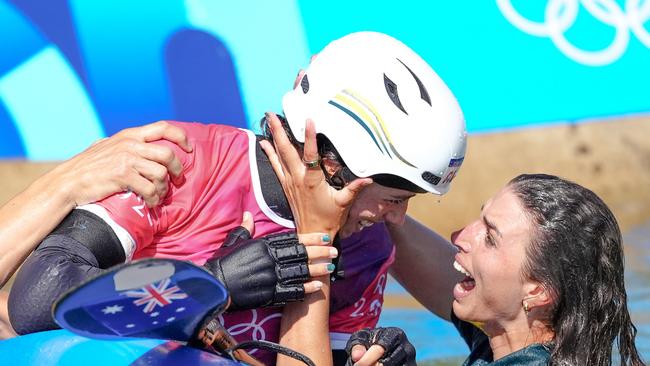 Australia's Noemie Fox (centre) celebrates winning gold in the Women's Kayak Cross Final at the Vaires-sur-Marne Nautical Stadium on the tenth day of the 2024 Paris Olympic Games in France. Picture date: Monday August 5, 2024. (Photo by John Walton/PA Images via Getty Images)